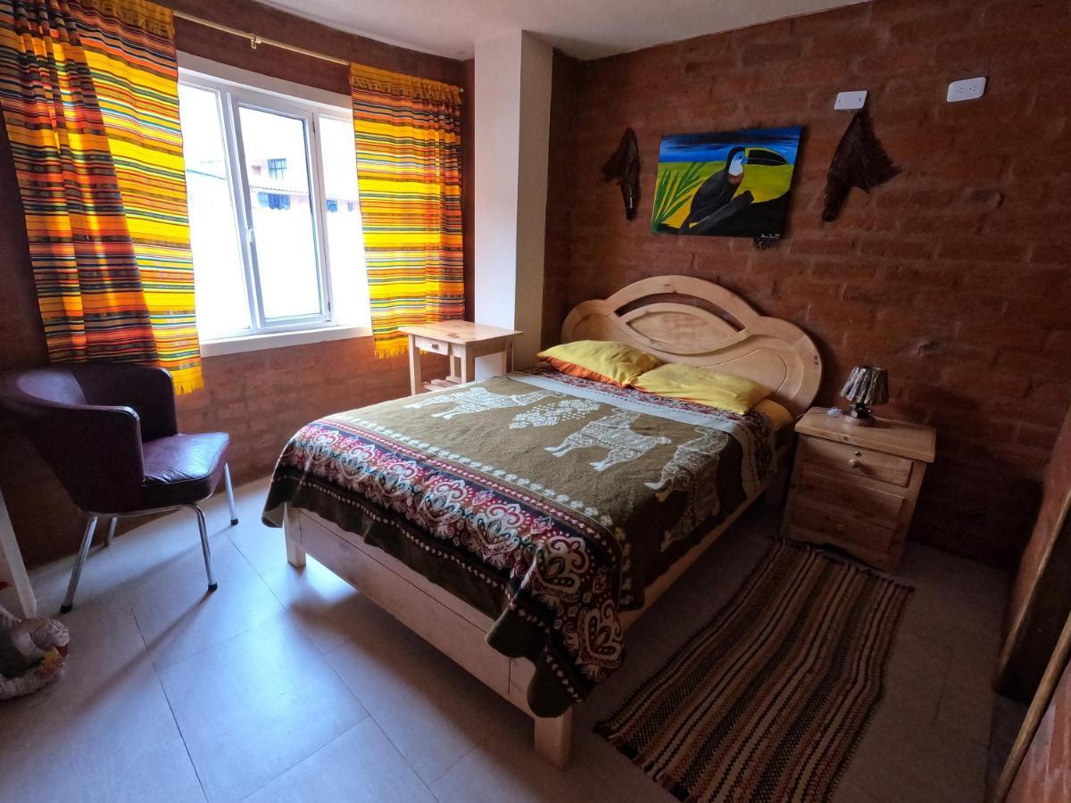 Hostal La Casa Amarilla City บาญอส ภายนอก รูปภาพ