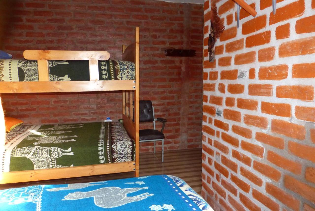 Hostal La Casa Amarilla City บาญอส ภายนอก รูปภาพ