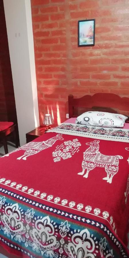 Hostal La Casa Amarilla City บาญอส ภายนอก รูปภาพ