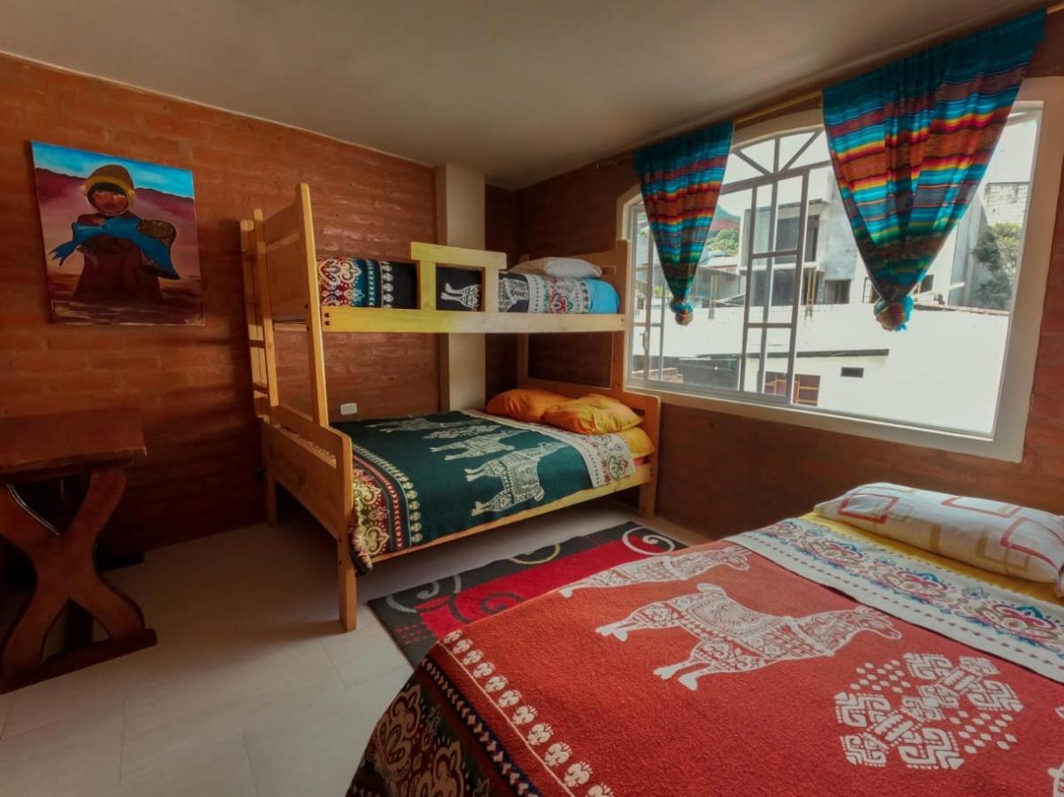 Hostal La Casa Amarilla City บาญอส ภายนอก รูปภาพ