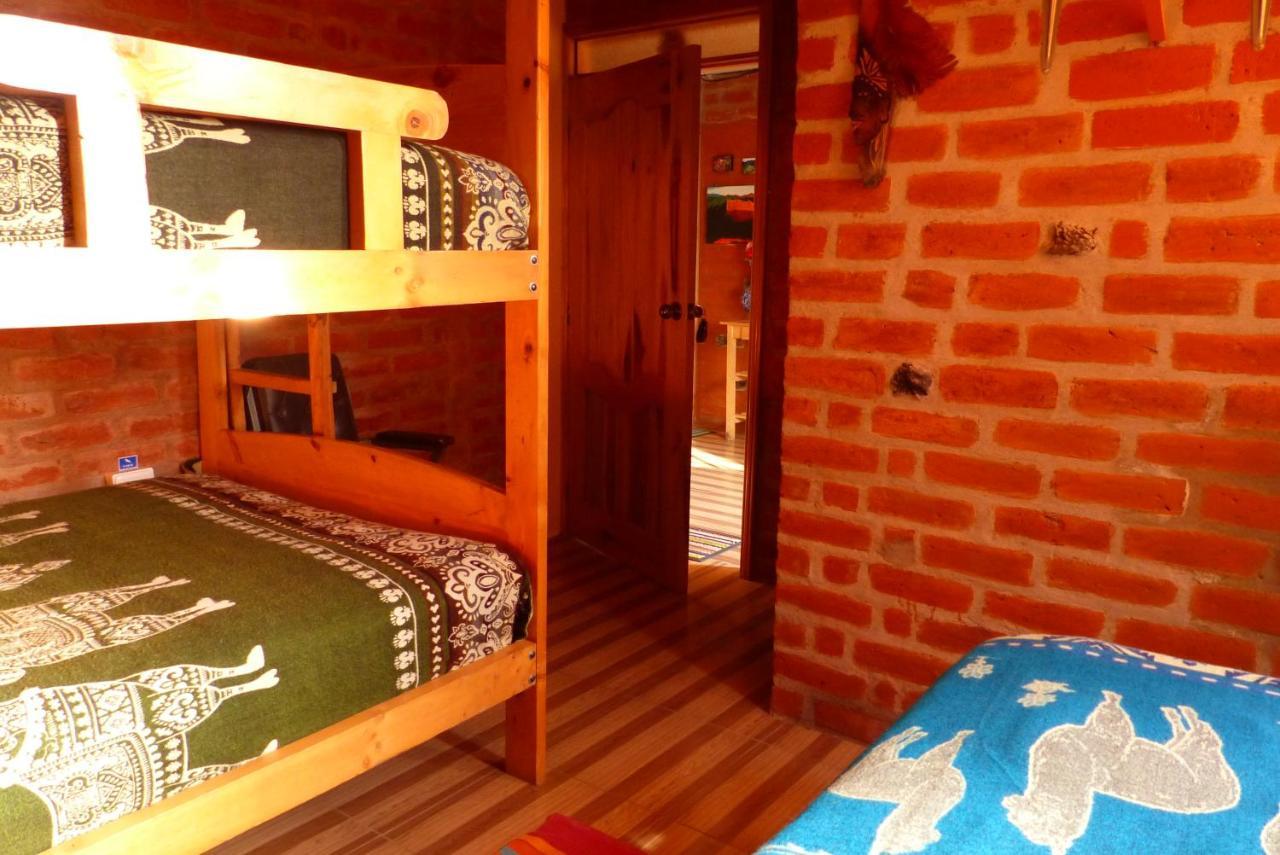 Hostal La Casa Amarilla City บาญอส ภายนอก รูปภาพ