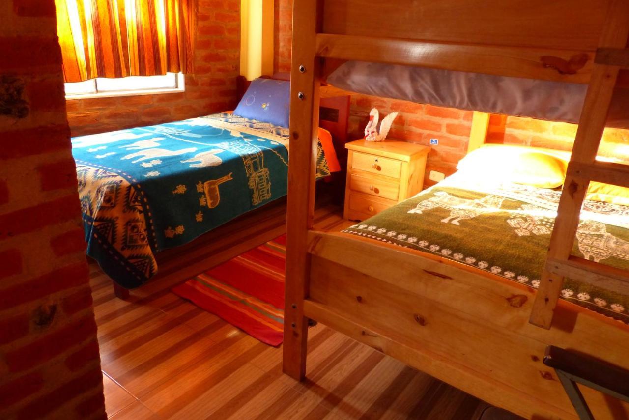 Hostal La Casa Amarilla City บาญอส ภายนอก รูปภาพ