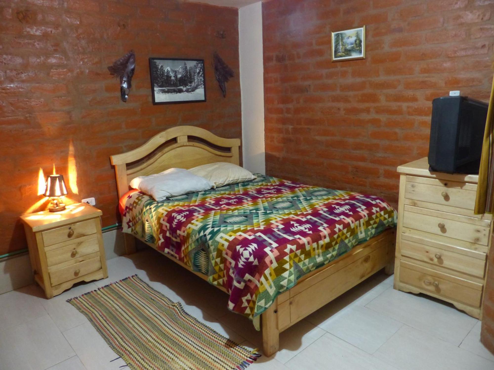 Hostal La Casa Amarilla City บาญอส ภายนอก รูปภาพ