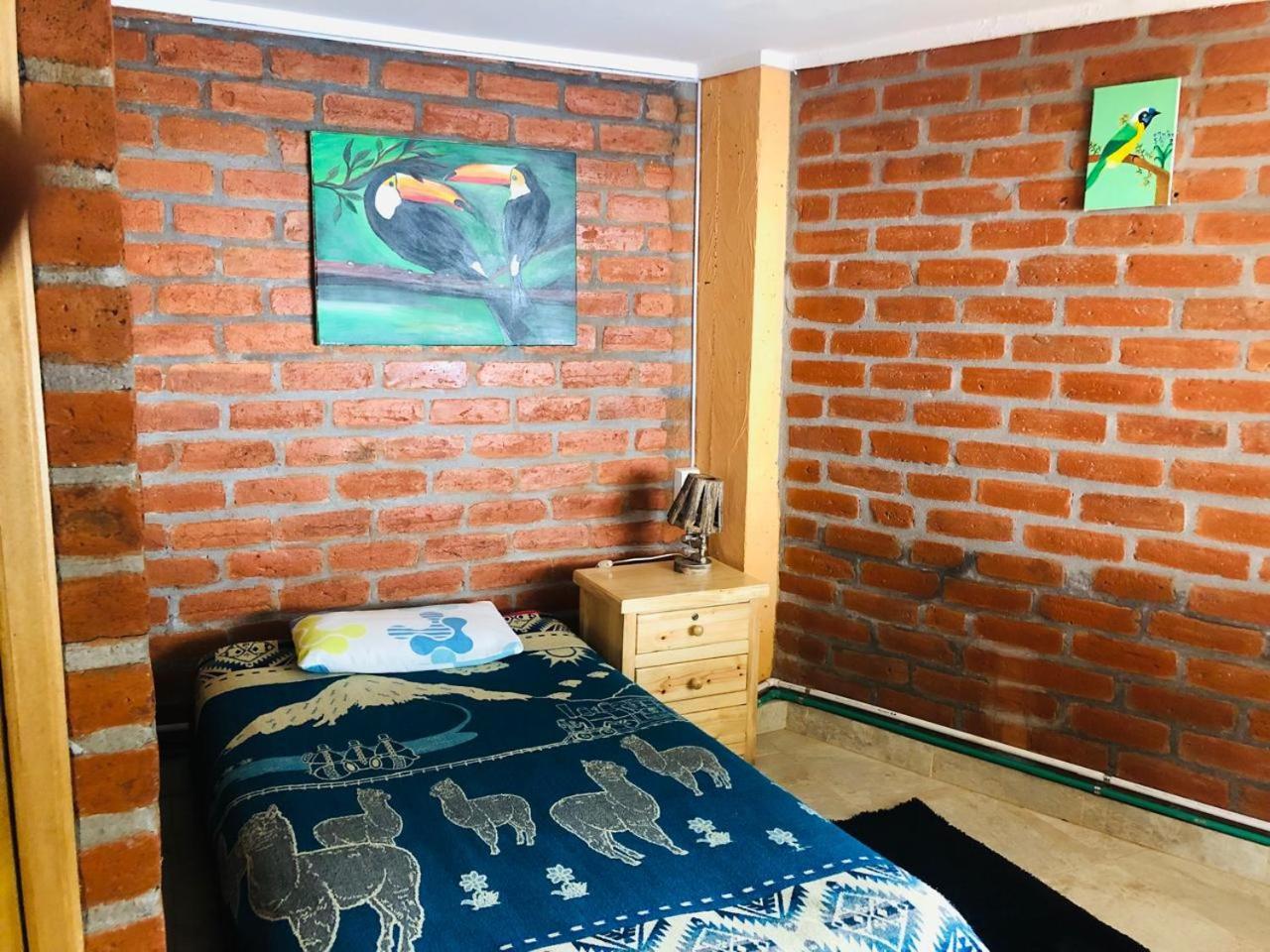 Hostal La Casa Amarilla City บาญอส ภายนอก รูปภาพ