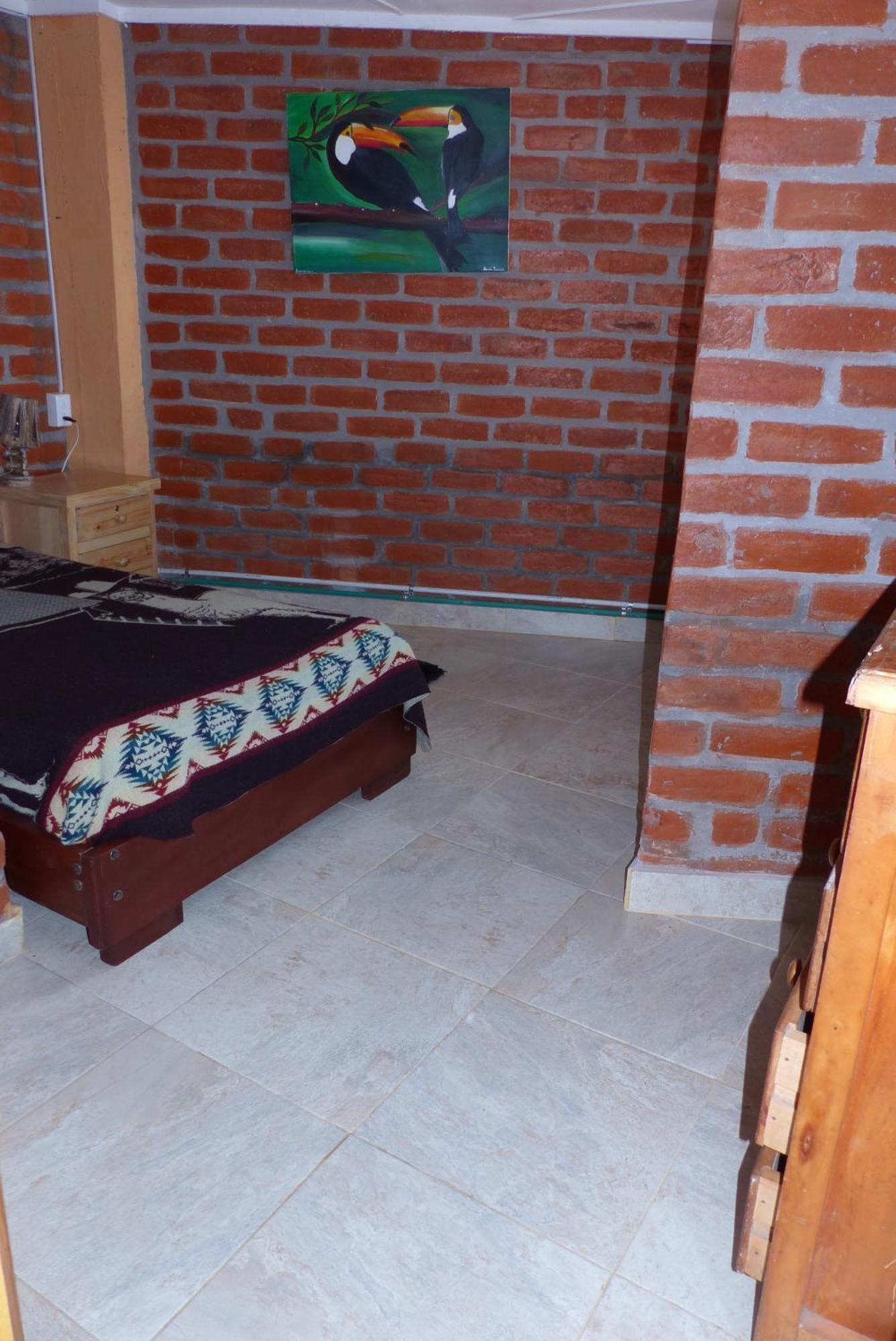 Hostal La Casa Amarilla City บาญอส ภายนอก รูปภาพ