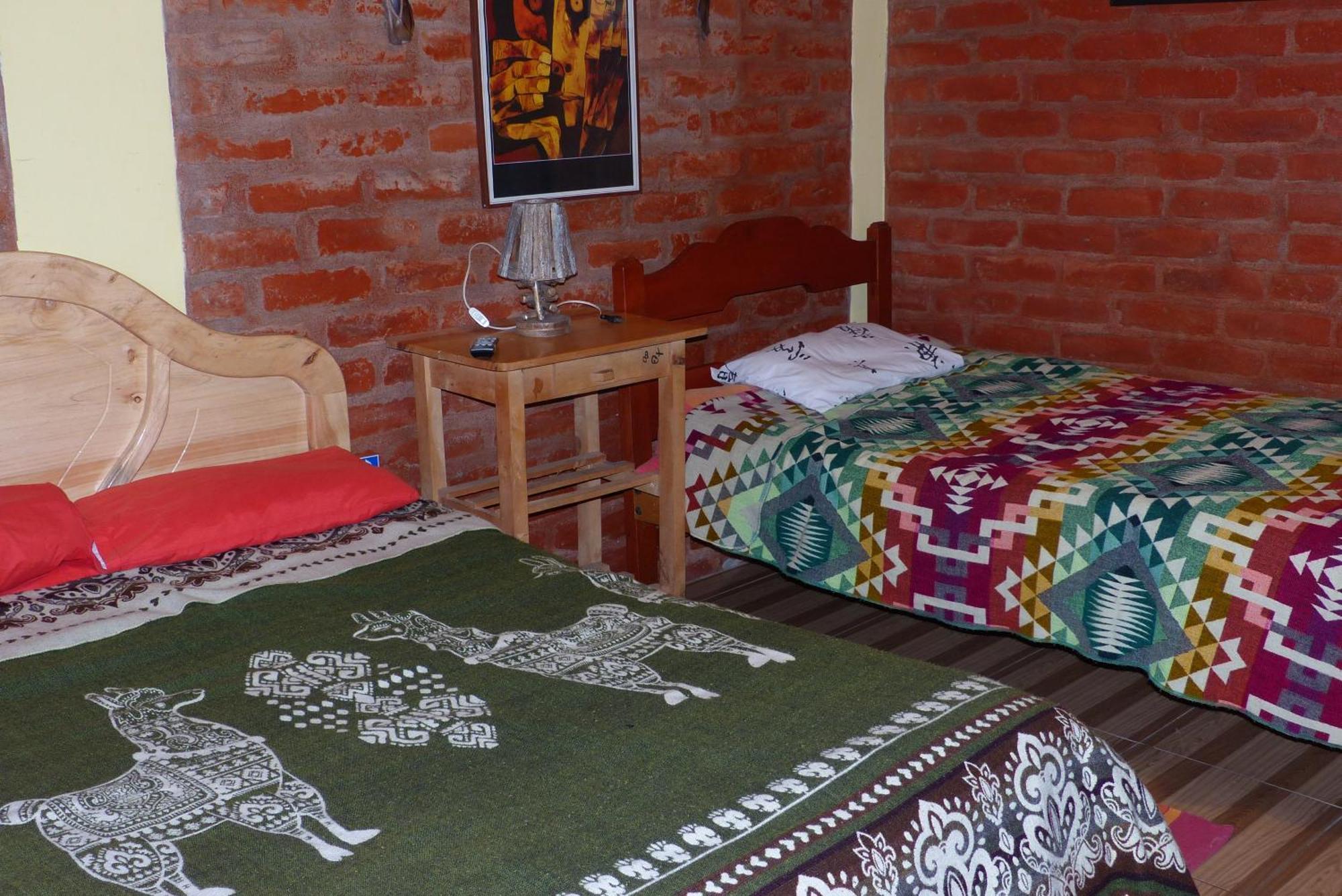 Hostal La Casa Amarilla City บาญอส ภายนอก รูปภาพ