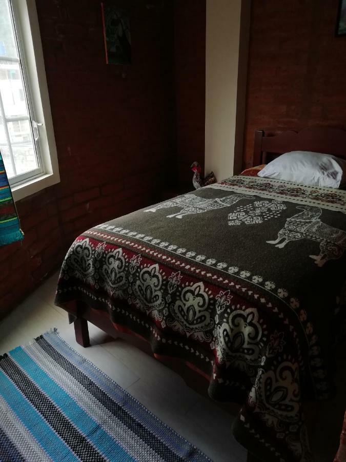 Hostal La Casa Amarilla City บาญอส ภายนอก รูปภาพ
