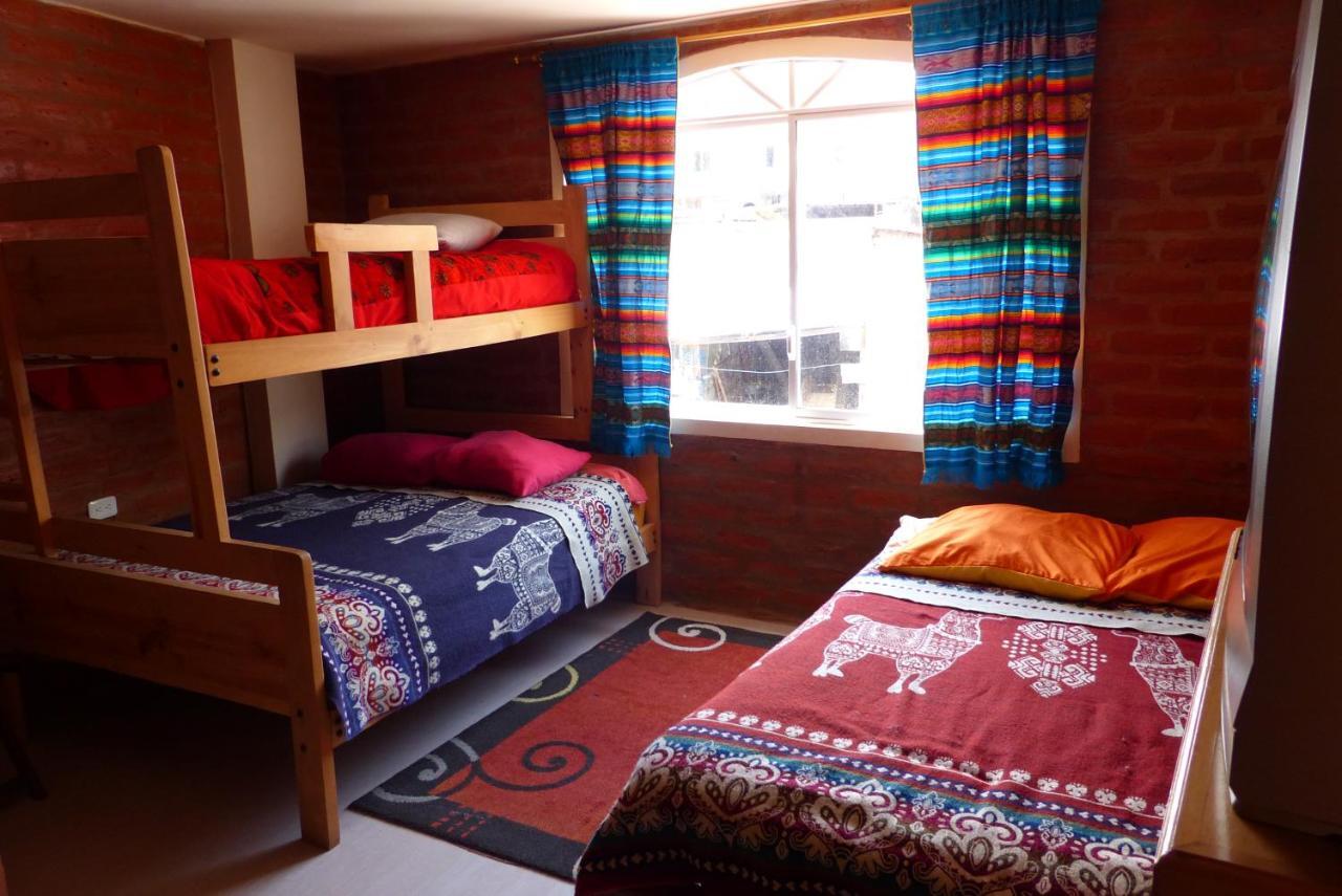 Hostal La Casa Amarilla City บาญอส ภายนอก รูปภาพ