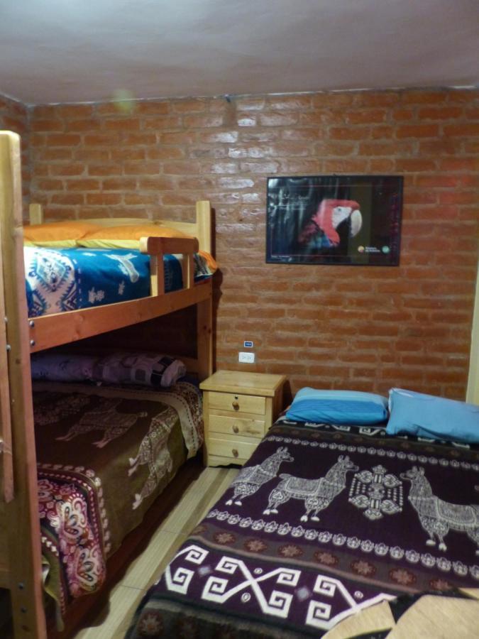 Hostal La Casa Amarilla City บาญอส ภายนอก รูปภาพ