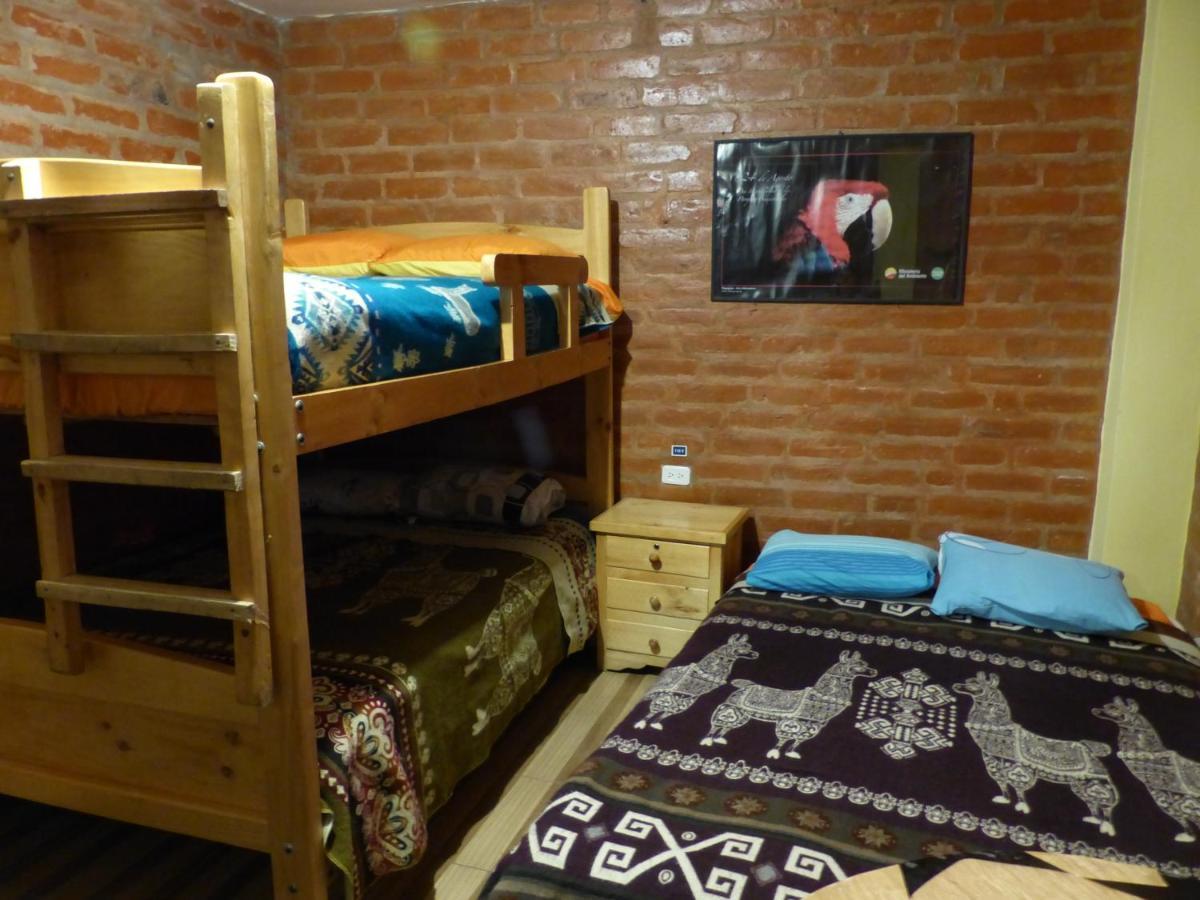 Hostal La Casa Amarilla City บาญอส ภายนอก รูปภาพ