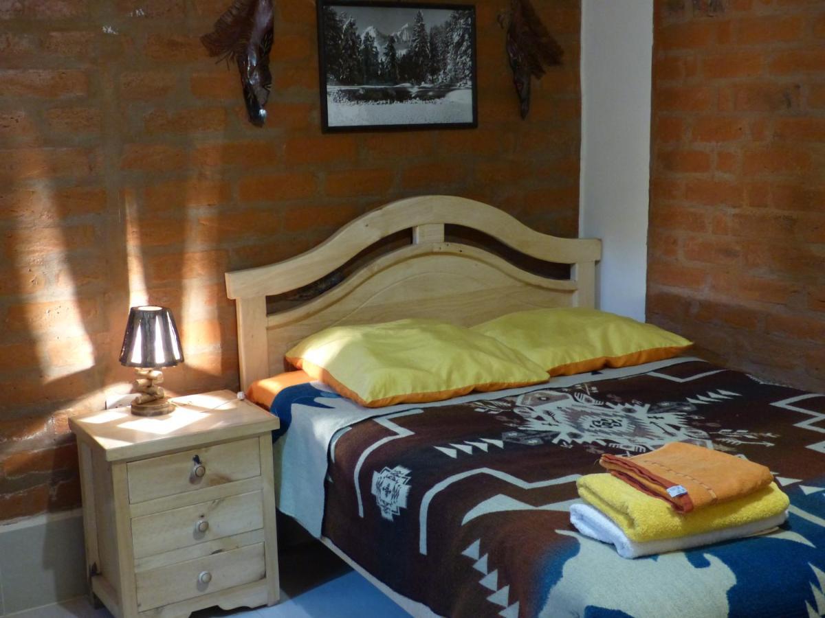 Hostal La Casa Amarilla City บาญอส ภายนอก รูปภาพ