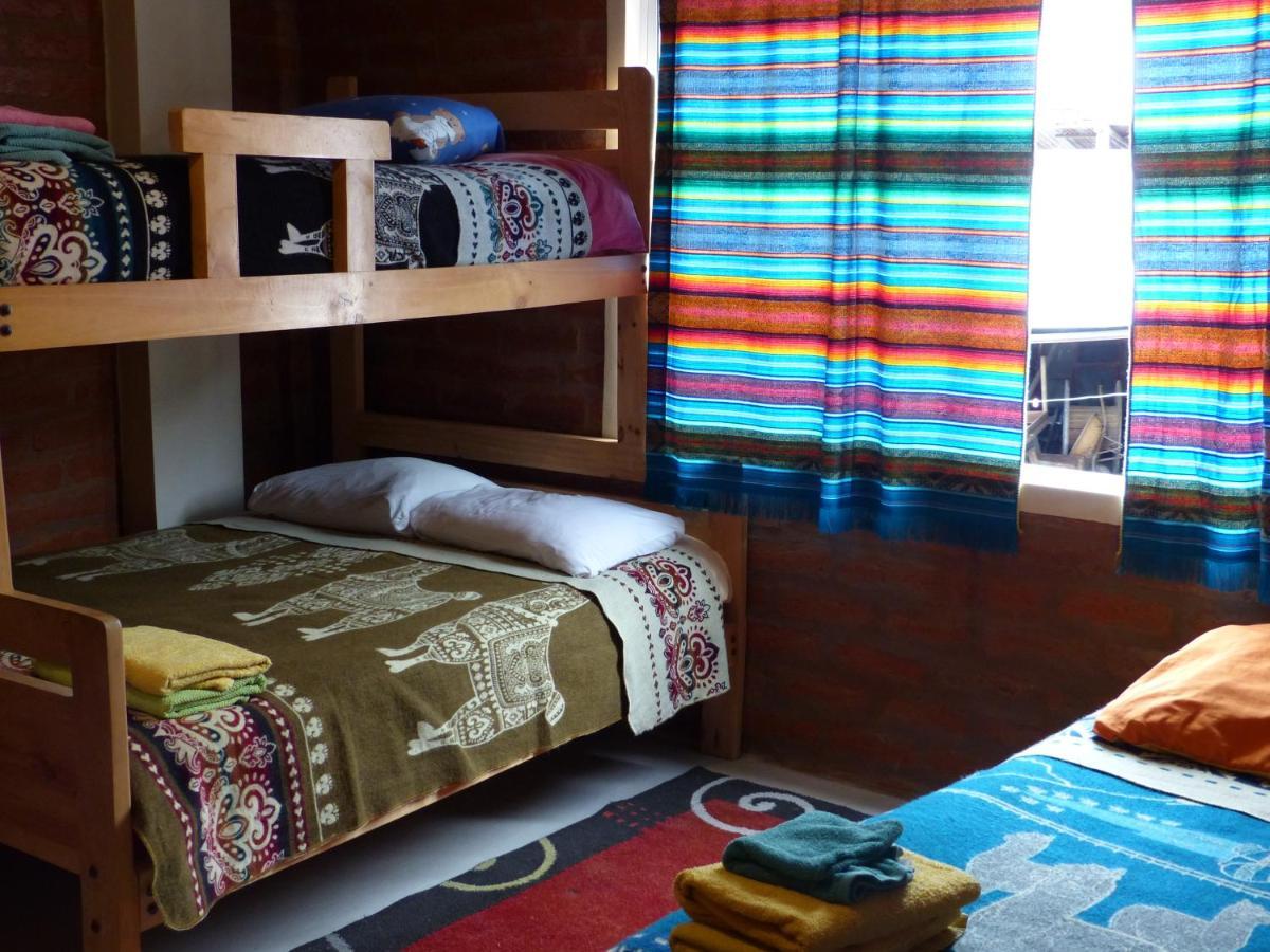Hostal La Casa Amarilla City บาญอส ภายนอก รูปภาพ